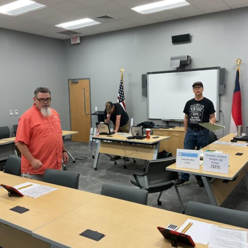 Amateur Radio Operators prparing a room for a test session.